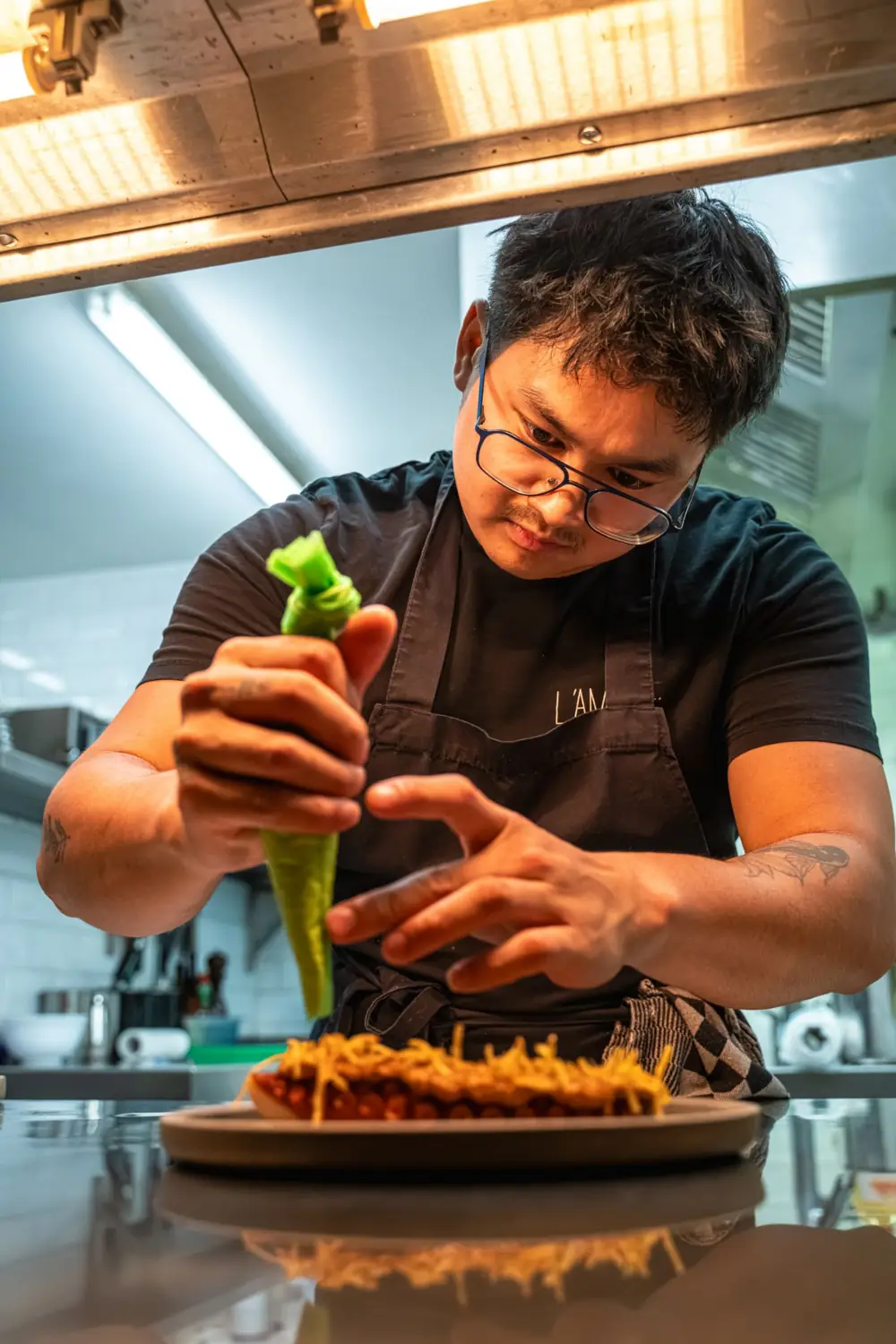 The chef plating a dish